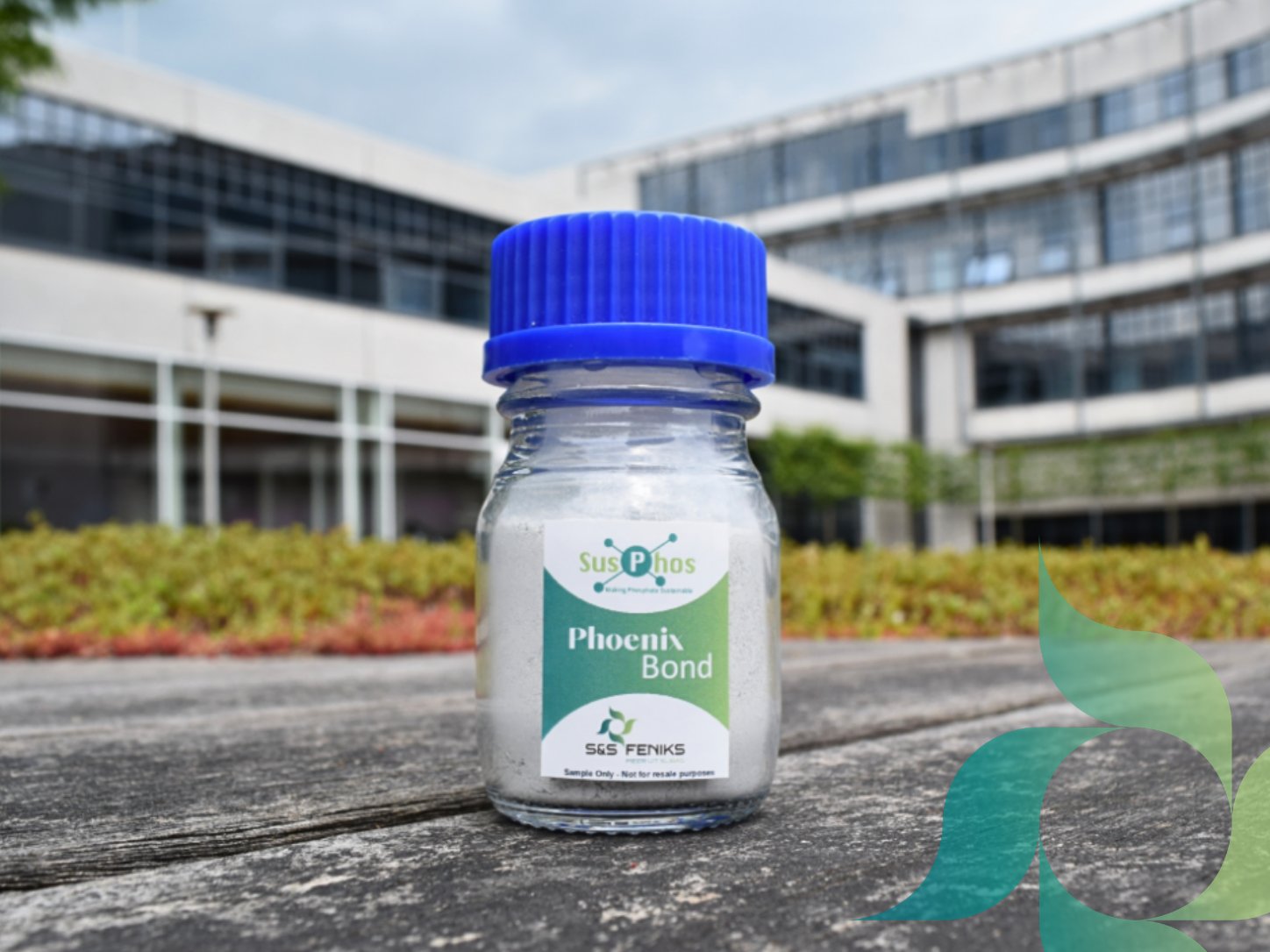 A sample jar of Phoenix Bond, a white powder cement replacer.
